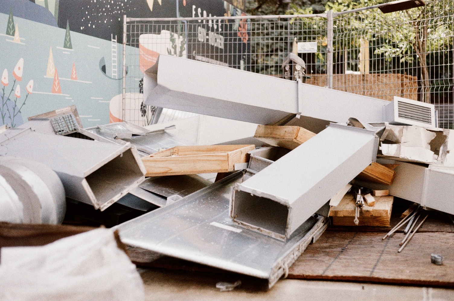 a pile of discarded ductwork
and scraps of wood.