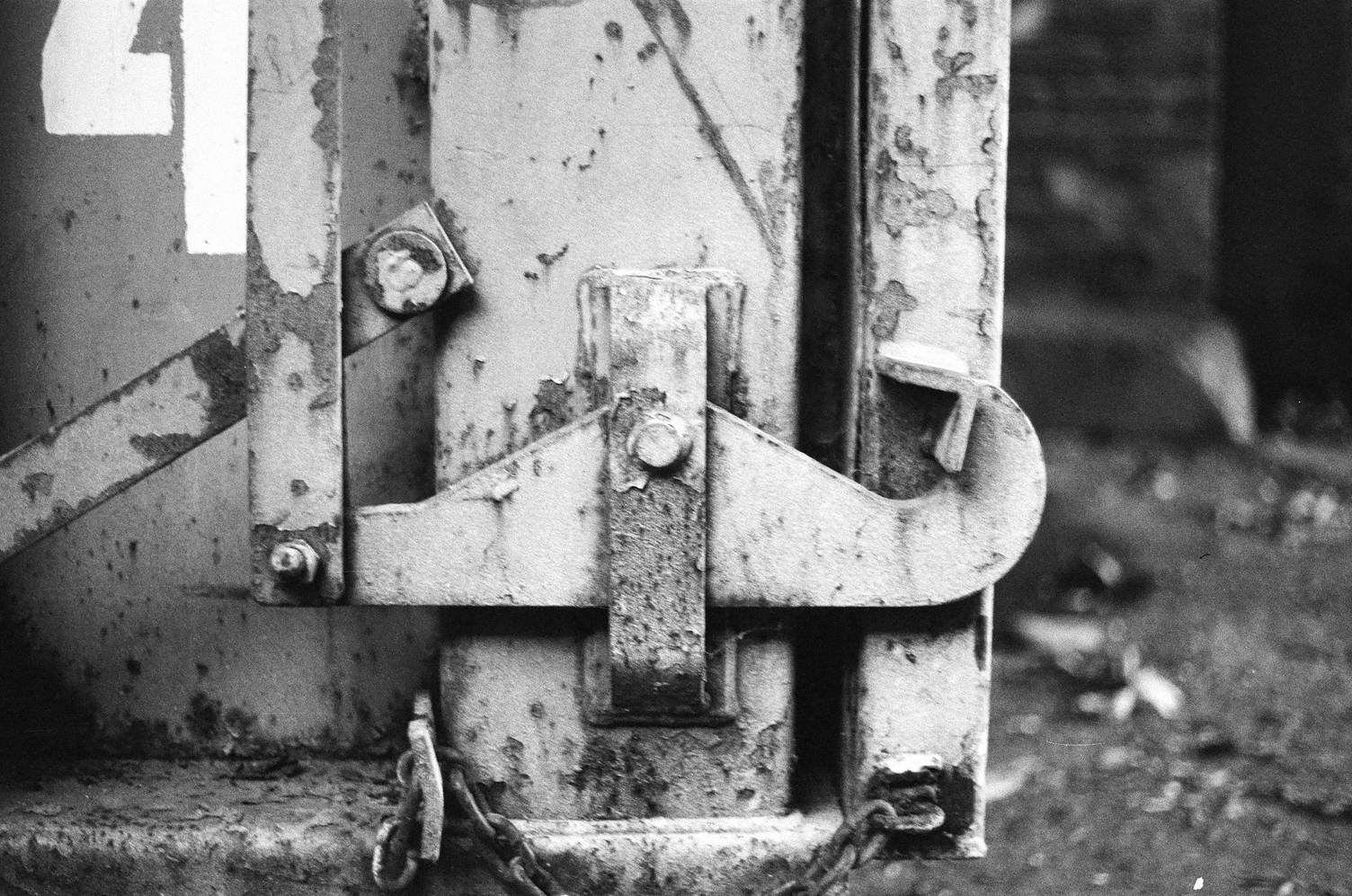 mechanical bits
at the bottom corner
of a big metal dumpster bin
you use to dispose of
construction detritus.