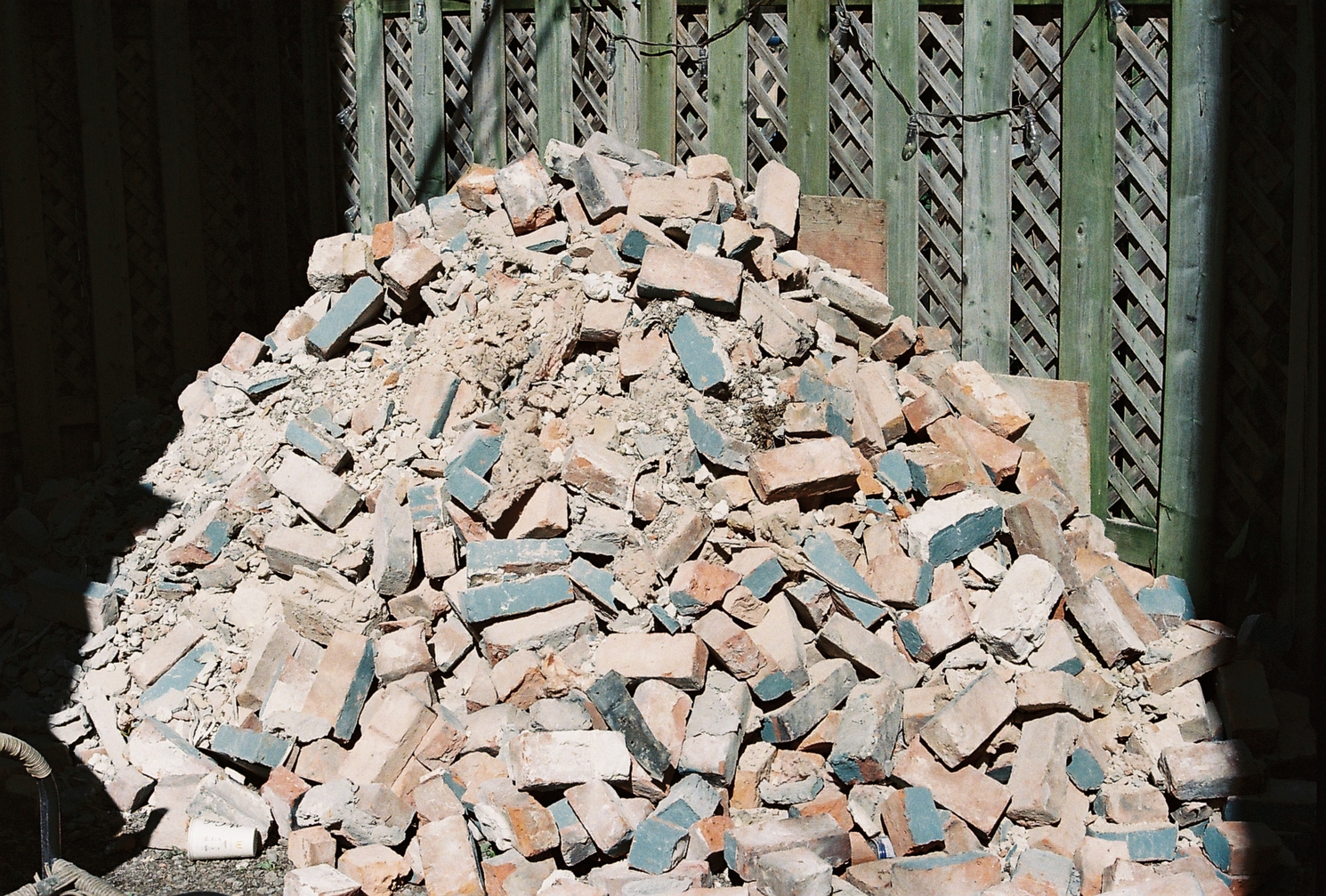 a pile of old bricks in the sunlight.
some of the faces of the bricks are painted grey-blue.
this is another one I'd love to take again
on black & white film.